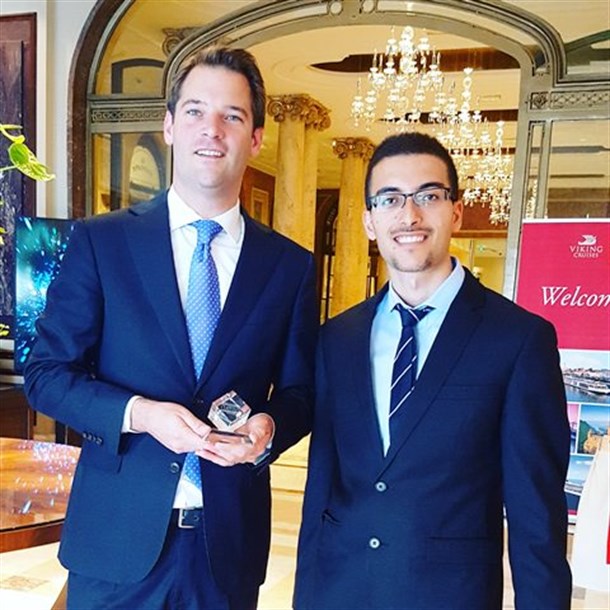 Shahar Ashkenazi (right) and a representative of the Athenee Palace Hilton Hotel, Bucharest